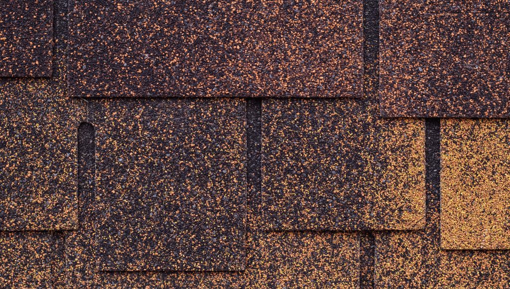 Close up of an asphalt shingle roof with granule loss.