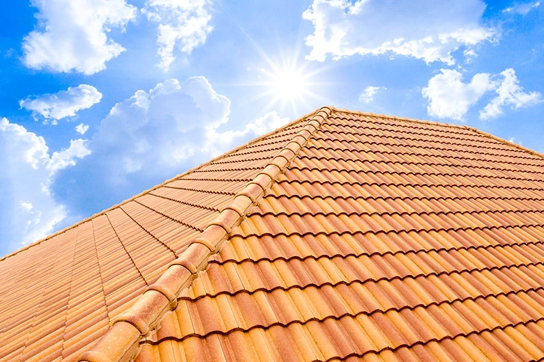 Water dripping from a roof during an active roof leak