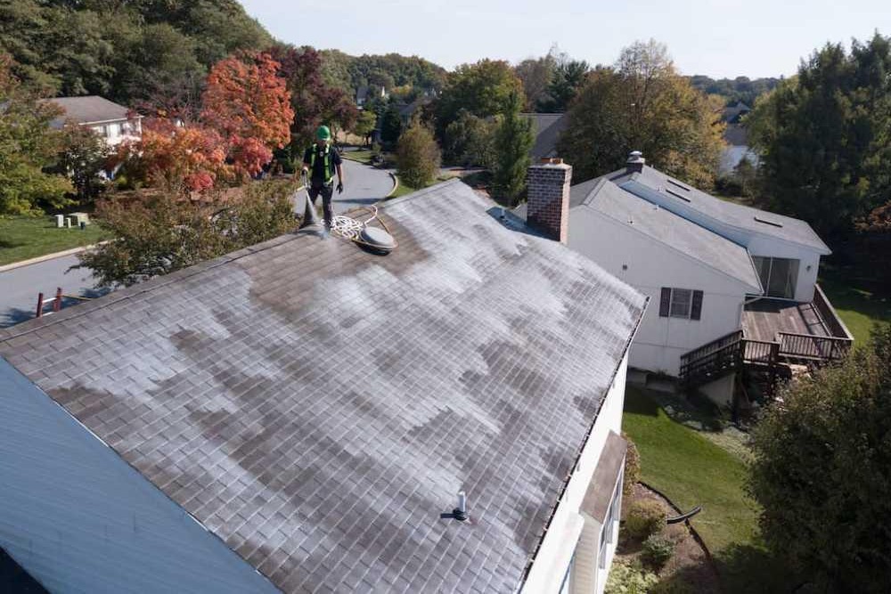 Roof vent pipe boot flashing Vent pipe boot flashing sealed on an asphalt shingle roof
