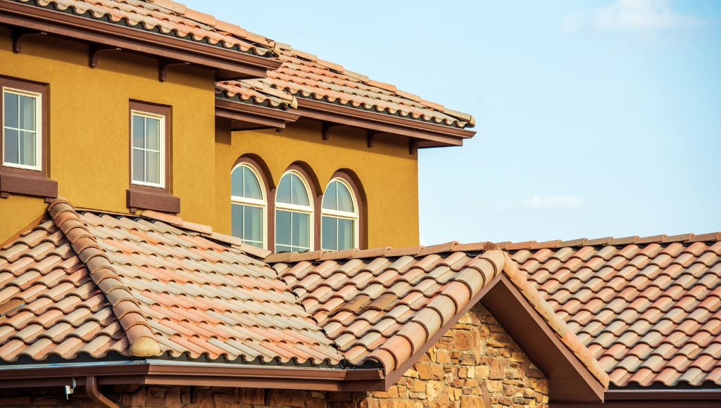 A close-up of a residential home featuring terracotta (clay) tiles.