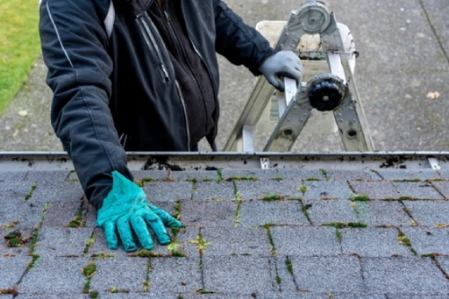 Water dripping from a roof during an active roof leak